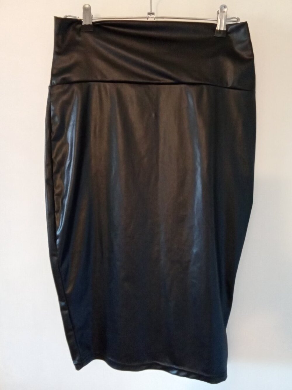 Women's pencil fit black midi skirt, leather like stretcg material,
